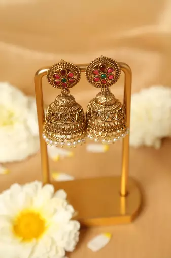 gold plated jhumka earrings with pearl drop design