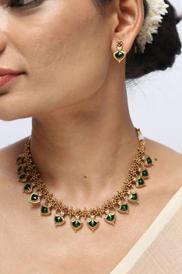 gold plated necklace set with emerald leaf motifs 2