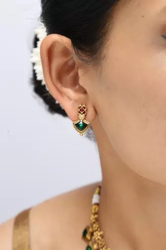 gold plated necklace set with emerald leaf motifs