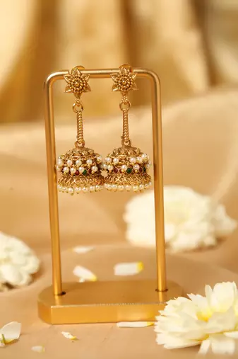 gold plated jhumka earrings with pearl accents