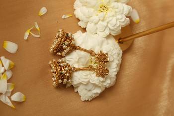 gold plated jhumka earrings with pearl accents 4
