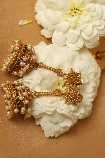 gold plated jhumka earrings with pearl accents