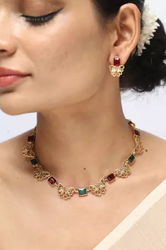 gold necklace with red & green stones