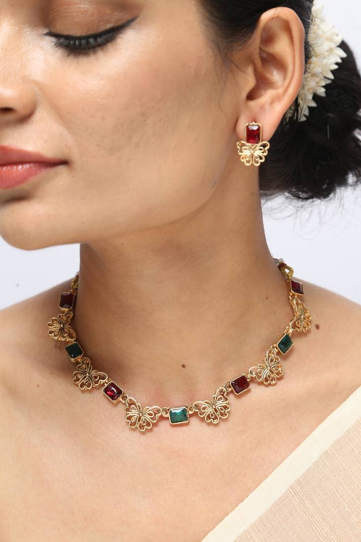 gold necklace with red & green stones