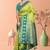 Parrot Green Banarasi Silk Blend Saree with Gold Zari Butta & Teal Heavy Woven Border by Maharanga