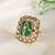 Gold plated kundan green stones ring
