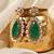 Gold plated kundan green stones dangler earrings