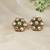 Gold plated kundan green stones stud earrings