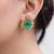 Gold plated kundan green stones stud earrings