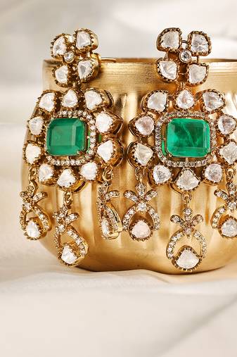 Gold plated kundan green stones dangler earrings
