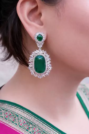 Gold plated kundan green stones dangler earrings