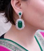 Gold plated kundan green stones dangler earrings