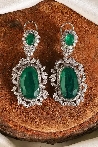 Gold plated kundan green stones dangler earrings