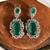 Gold plated kundan green stones dangler earrings