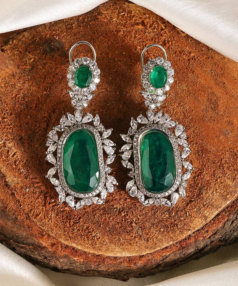 Gold plated kundan green stones dangler earrings