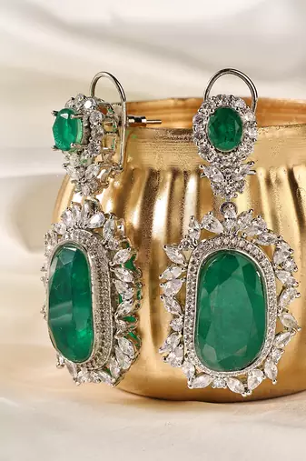 Gold plated kundan green stones dangler earrings
