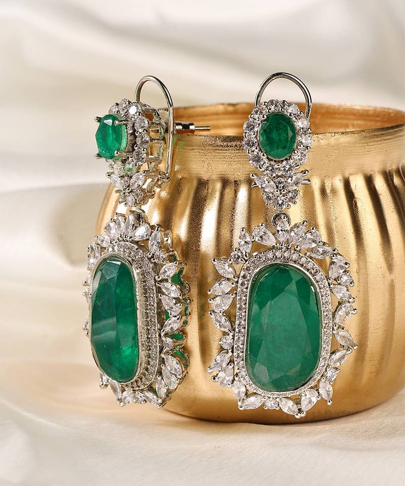 Gold plated kundan green stones dangler earrings