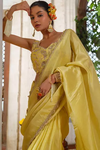 Yellow embroidered tissue silk saree