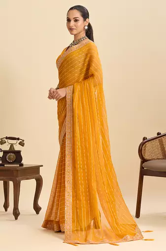mustard party wear georgette fancy saree with embroidery and designer pallu