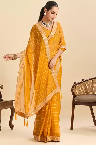 mustard party wear georgette fancy saree with embroidery and designer pallu