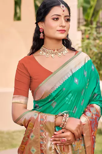 rama green color pochampally silk blend weaving work saree