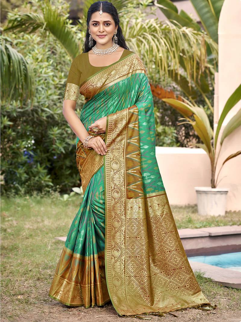 rama green color pochampally silk blend weaving work saree