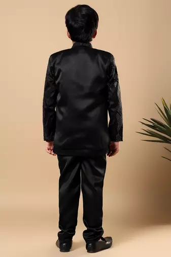 Boys black satin wavy embroidered sequined sherwani & trouser set with shrug and necklace