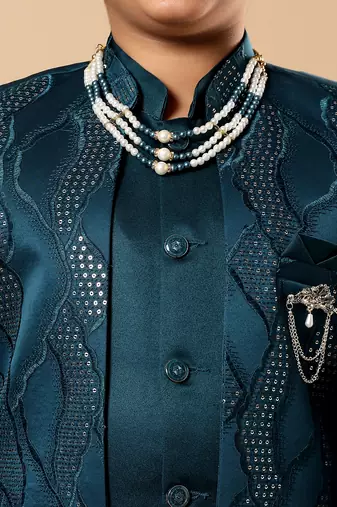 Boys teal blue satin wavy embroidered sequined sherwani & trouser set with shrug and necklace