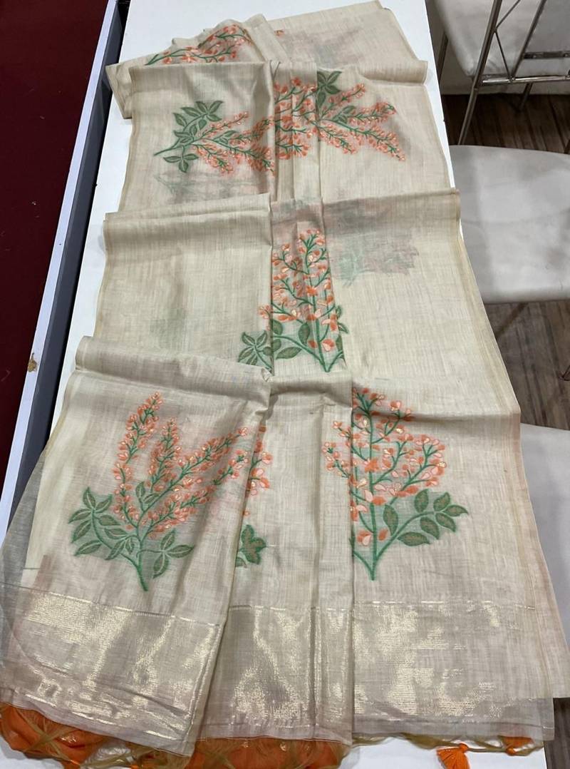 Cream woven muga cotton saree with blouse piece