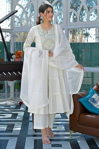 Blooming white cotton salwar suit with embroidered and lace work