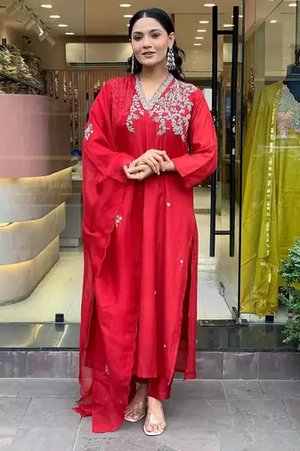 Women's trending red embroidered kurta set featuring elegant white floral neckline work