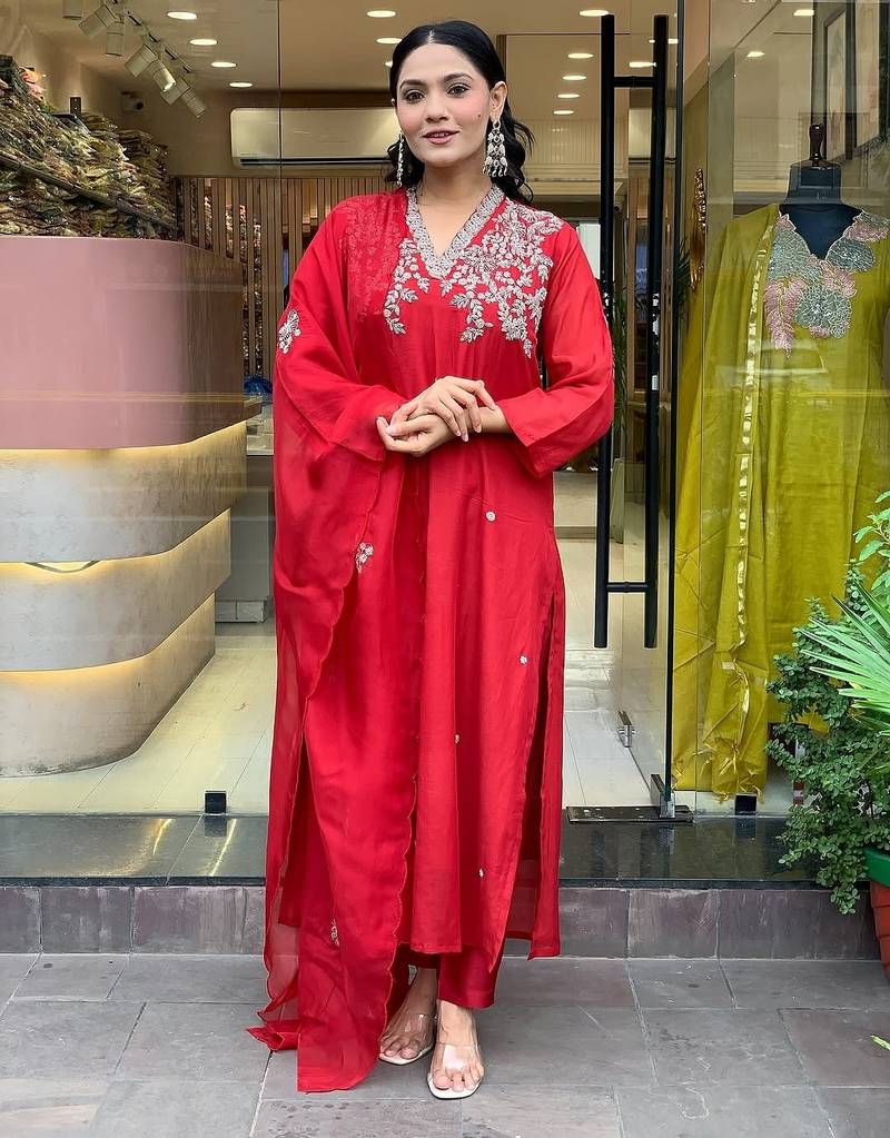 Women's trending red embroidered kurta set featuring elegant white floral neckline work