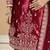 Embroided maroon salwar suit made of ice velvet with net dupatta