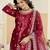 Embroided maroon salwar suit made of ice velvet with net dupatta