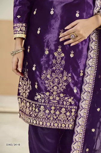 Embroided purple salwar suit made of ice velvet with net dupatta