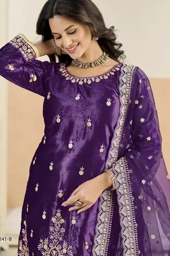 Embroided purple salwar suit made of ice velvet with net dupatta