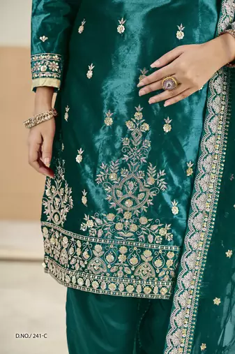Embroided rama salwar suit made of ice velvet with net dupatta