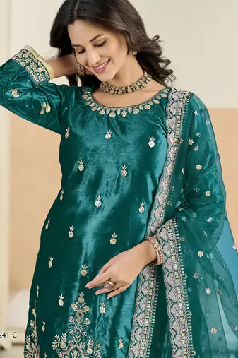 Embroided rama salwar suit made of ice velvet with net dupatta