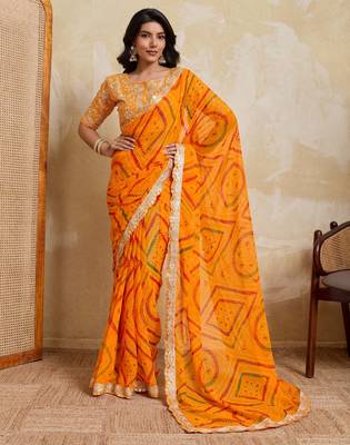 Enchanting yellow georgette bandhej print with cutwork lace border saree with mono banglory silk blouse 1