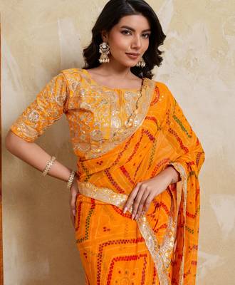 Enchanting yellow georgette bandhej print with cutwork lace border saree with mono banglory silk blouse 2