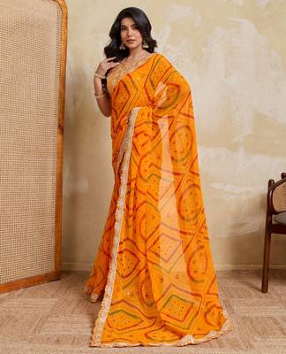 Enchanting yellow georgette bandhej print with cutwork lace border saree with mono banglory silk blouse 3