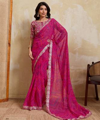 Mesmerizing pink georgette bandhej print with cutwork lace border saree with mono banglory silk blouse 1