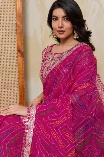 Mesmerizing pink georgette bandhej print with cutwork lace border saree with mono banglory silk blouse