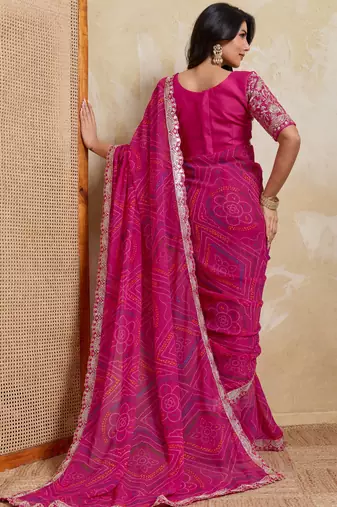 Mesmerizing pink georgette bandhej print with cutwork lace border saree with mono banglory silk blouse