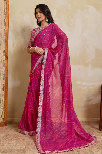 Mesmerizing pink georgette bandhej print with cutwork lace border saree with mono banglory silk blouse