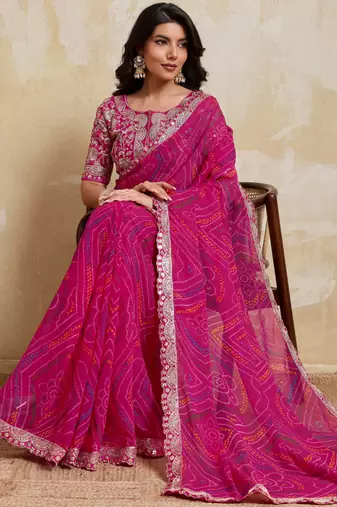 Mesmerizing pink georgette bandhej print with cutwork lace border saree with mono banglory silk blouse