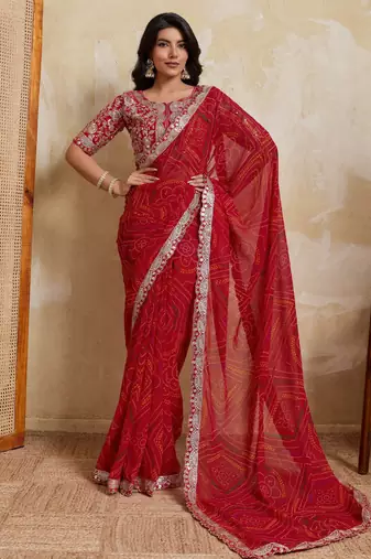 Catching red georgette bandhej print with cutwork lace border saree with mono banglory silk blouse