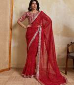 Catching red georgette bandhej print with cutwork lace border saree with mono banglory silk blouse