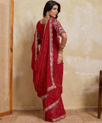 Catching red georgette bandhej print with cutwork lace border saree with mono banglory silk blouse 3