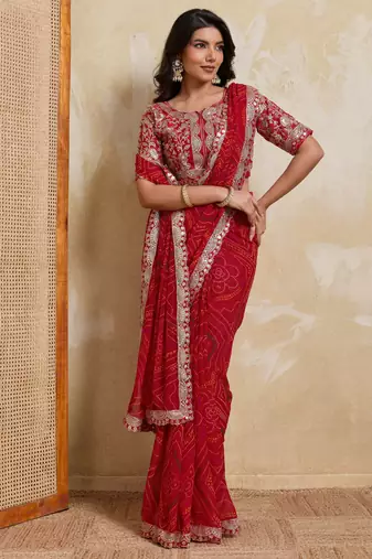 Catching red georgette bandhej print with cutwork lace border saree with mono banglory silk blouse